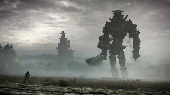 Wander, a man holding a sword, faces a giant creature covered in stones in Shadow of the Colossus.