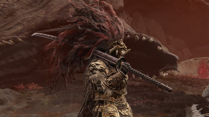 A warrior with a large red plume helmet holds the Great Katana sword in front of a slain dragon with its mouth hanging open in Elden Ring Shadow of the Erdtree.