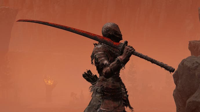 A warrior in Rakshasa's Armor set holds Rakshasa's Great Katana sword in profile in Elden Ring Shadow of the Erdtree.