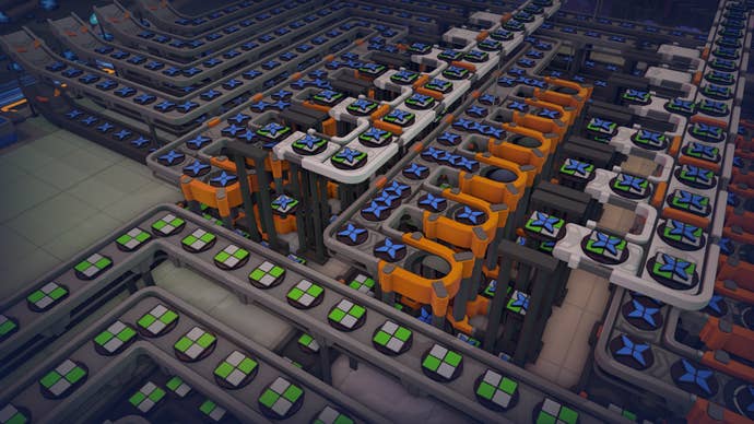 A close-up of a section of a factory module in Shapez 2 which combines two shapes atop one another.