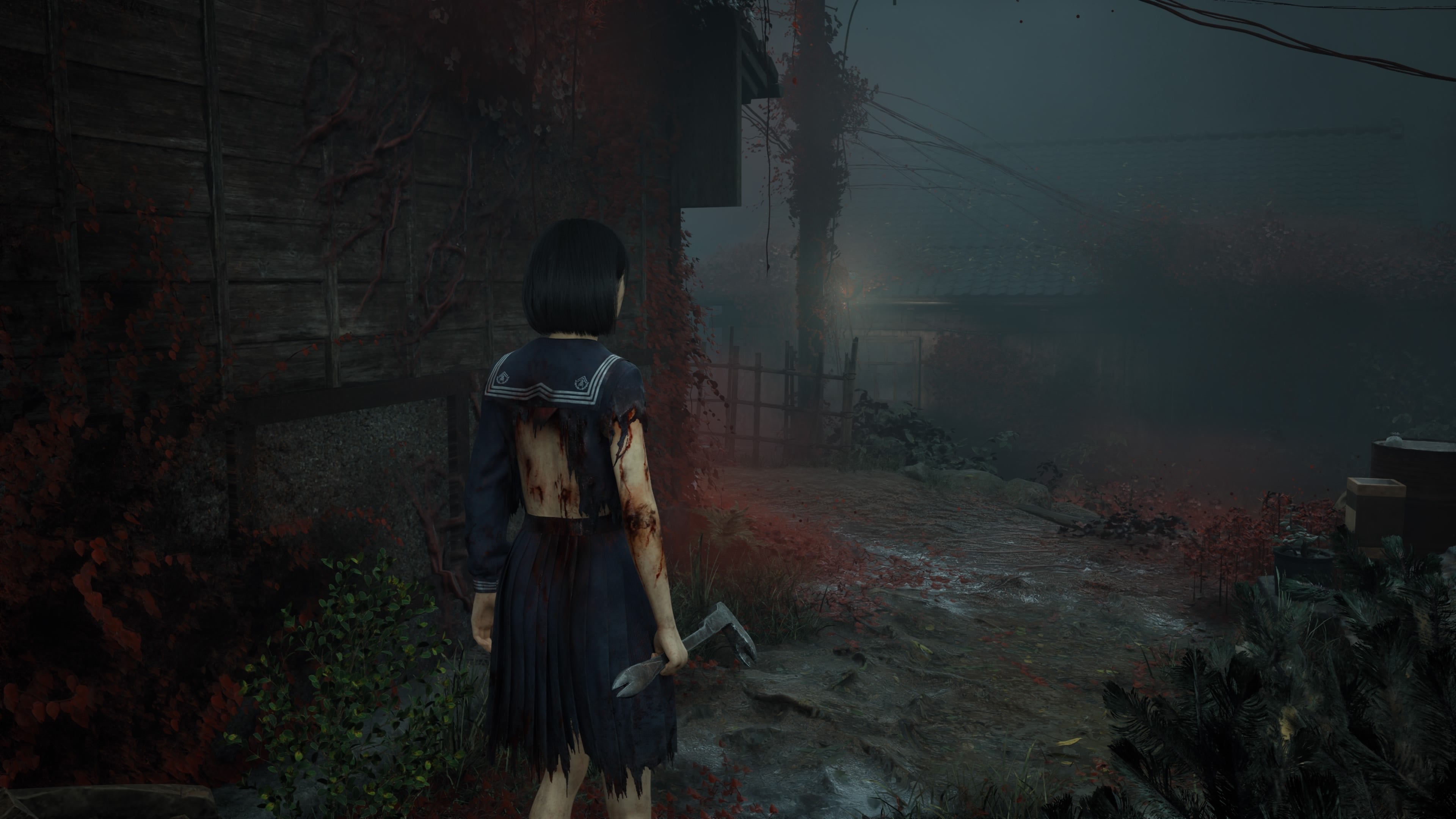 Hinako, her sleeve and back torn and shredded, showing bloody wounds, stands next to a building covered in red petals, holding a crowbar. In the background is another building and an ominous light.