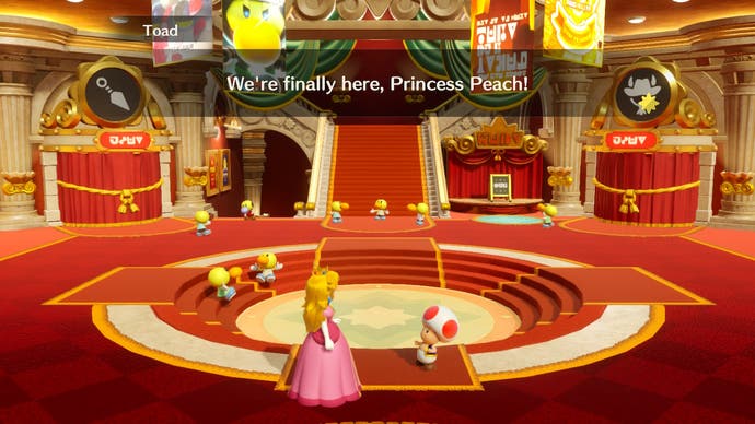Image one: Princess Peach: Showtime! screenshot shows the ornate entrance to the Sparkle Theater lobby.