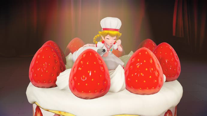 Eight: Princess Peach: Showtime! screenshot shows Peach sitting on top of a gigantic strawberry cake with whipped cream.