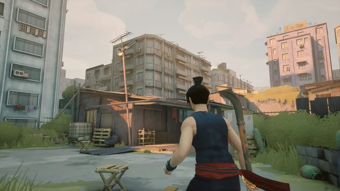 The protagonist from Sifu approaches a block of flats. The lighting indicates it’s golden hour.