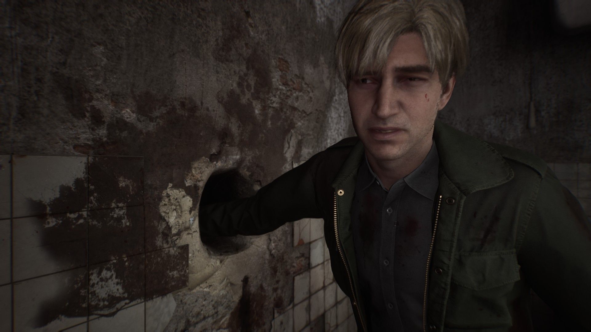 James sticks his arm down a hole to look for an item. - 11