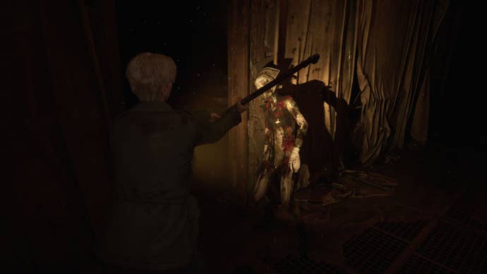 James strikes a monster with a lead pipe.