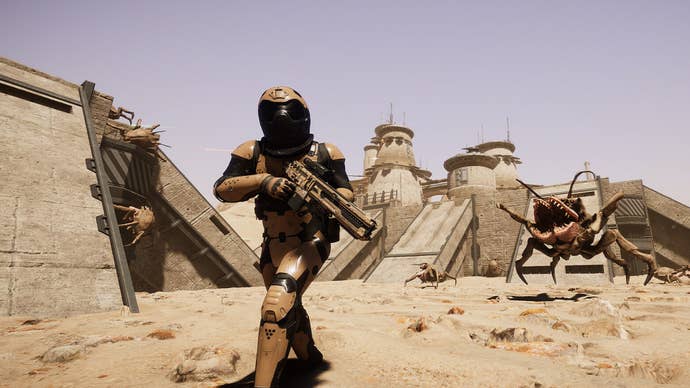 A sapce soldier runs away from an alien crab that’s leapt at them, on a barren, desert planet in Silica.