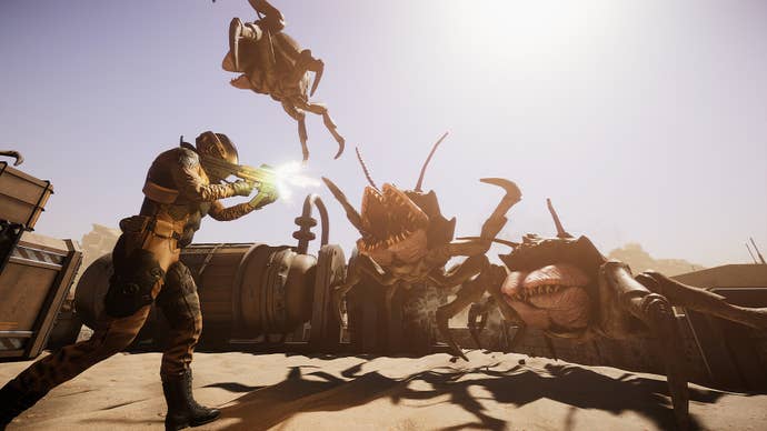 A soldier opens fire on many-mouthed alien crabs in Silica.