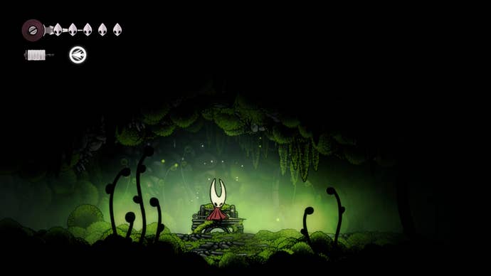 Hollow Knight: Silksong screenshot showing the hornet sat on a bench in near pitch black, with green hue around them