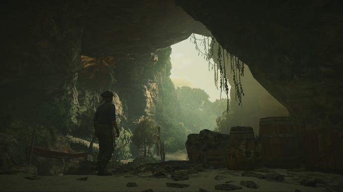 Skull and Bones screenshot showing a pirate in a cave mouth looking outwards
