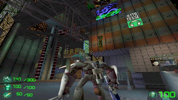 Slave Zero screenshot showing a 3D mech in an industrial futuristic city from a behind-the-back view