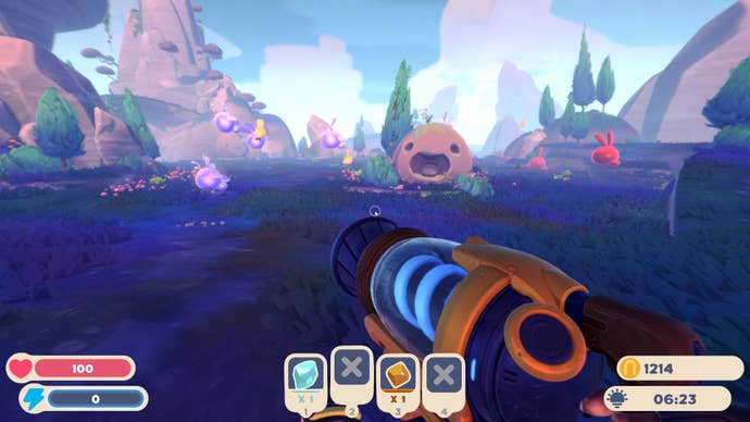A beautiful purple field full of slimes in Slime Rancher 2