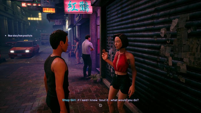 A man speaks to a prostitute outside a brothel on Kowlong's seedy streets.
