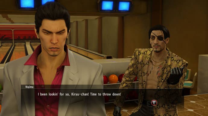 Majima approaches Kiryu in a bowling alley in Yakuza