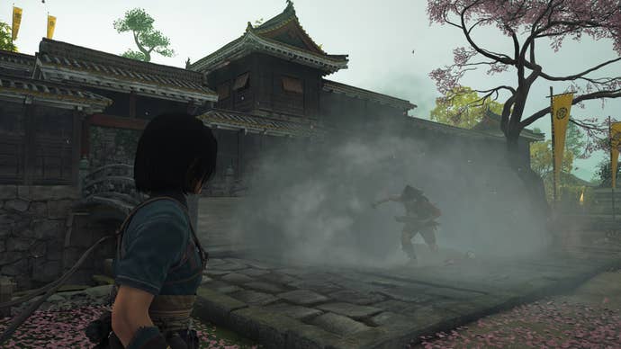 Naoe uses a smoke bomb to disorient an opponent in Assassin’s Creed Shadows.