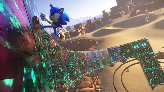 Sonic Frontiers preview - Sonic running towards the camera on a vertical wall in the desert open zone