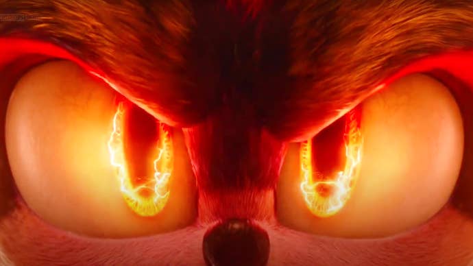 A shot from the Sonic the Hedgehog 2 movie showing a close-up of Shadow’s eyes, the pupil’s ringed with fire.