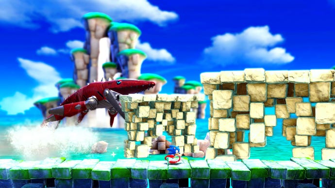 Sonic whizzes away from a robo shark that's leap out of the water in Sonic Superstars.