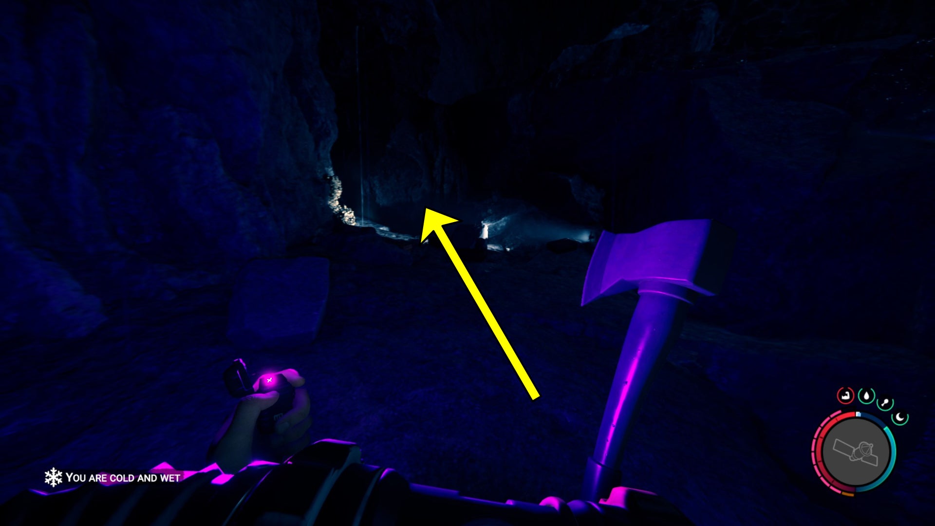 The player in Sons Of The Forest follows a light source in a cave. - 6