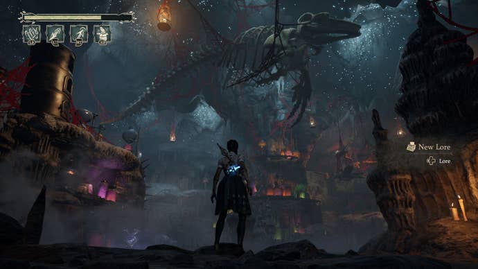 Hazels looks up at a whale skeleton hanging from the cave ceiling.