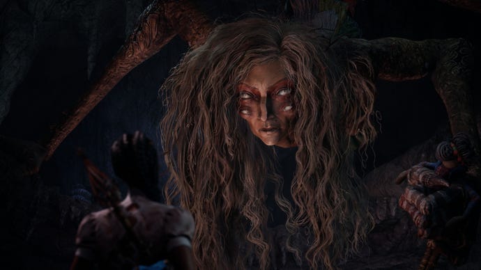 Uma mulher de olhos brancos com cabelos desgrenhados olha para Hazel.