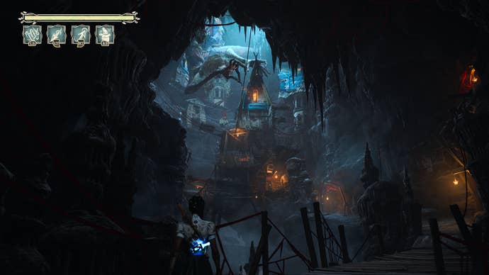 South of Midnight screenshot showing a stunning entry to a dark cave with giant spider
