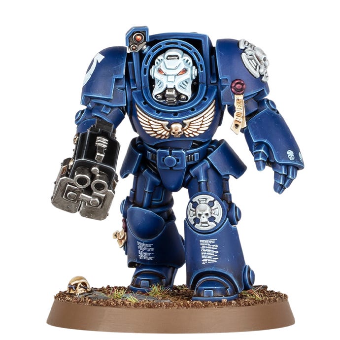 A Space Marine miniature with blue armour and a big gun