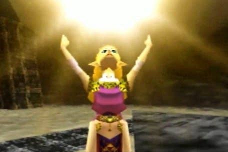 Zelda from Ocarina of Time stands, arms raised, with golden light above her.