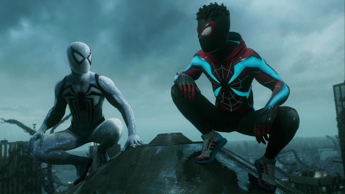 spider-man 2 anti venom peter and evolved suit miles sat on top of a building