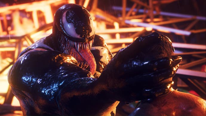 spider-man 2 close up of venom holding kraven by his head