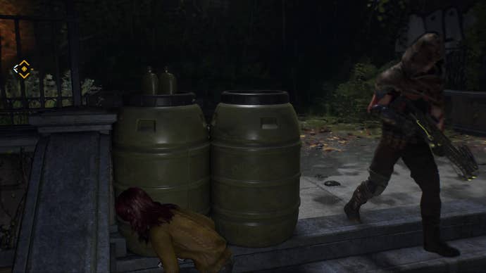 MJ crouches behind some barrels while a Hunter guard passes by her on the stairs, oblivious.