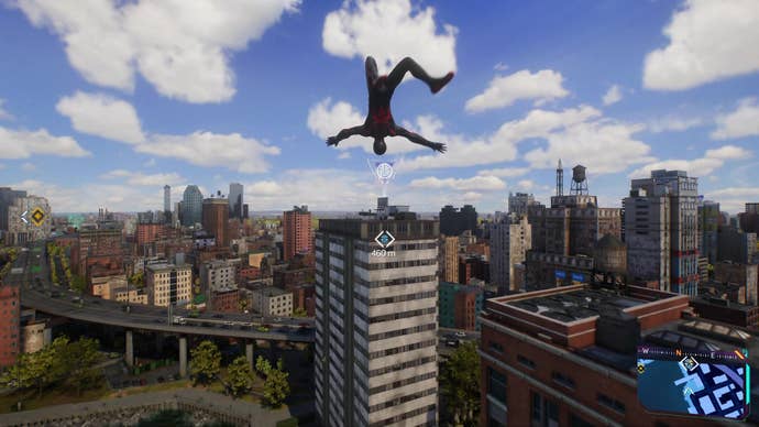 Miles Morales as Spider-Man freefalls after a web swing, far above the city, with skyscrapers and a highway visible in the distance.