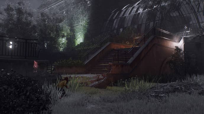 spider-man 2 mj crouching by stone steps leading up to broken glass house