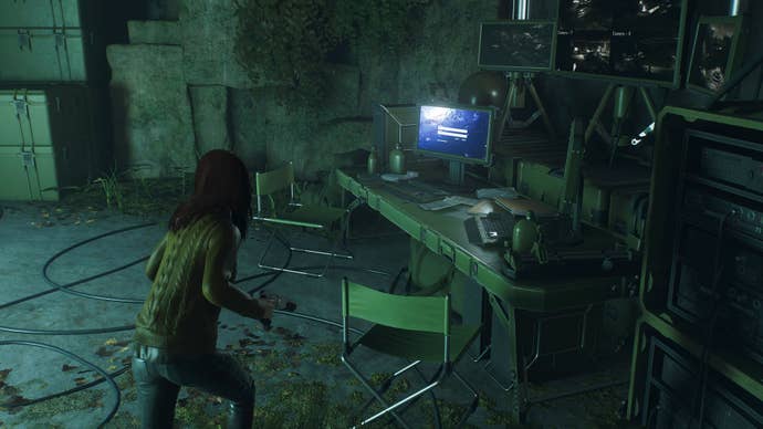 spider-man 2 mj facing computer terminal in a cave