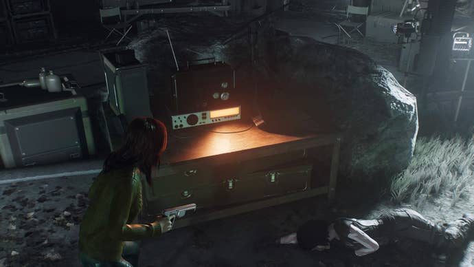 spider-man 2 mj is facing radio on table in a cave.