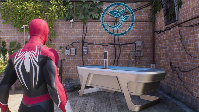 spider-man 2 peter parker spider-man in black and red suit looking at emf plant experiment kiosk table