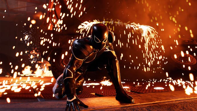 spider-man 2 symbiote harry is crouching in the foundry with sparks flying around him.