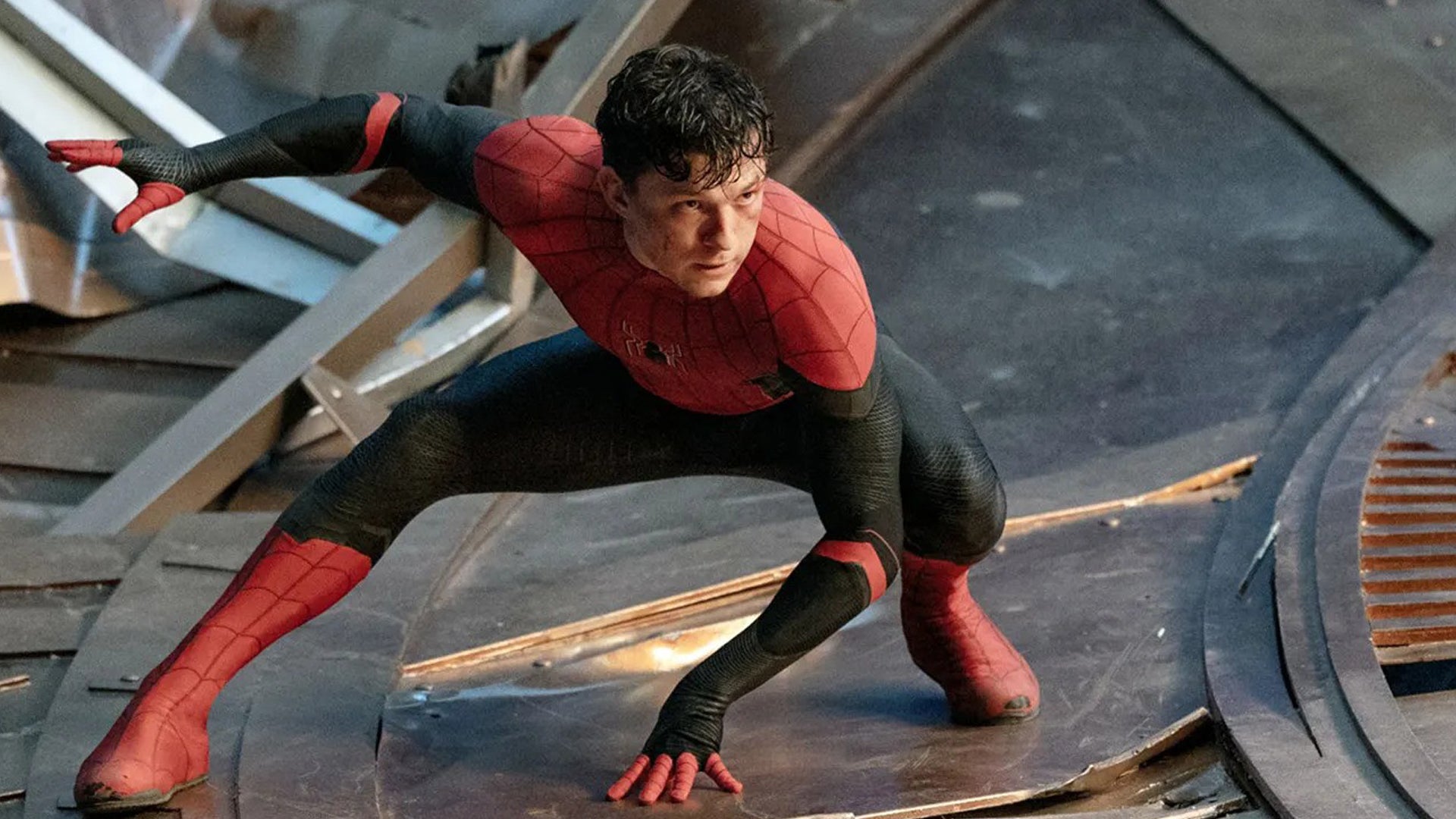 Tom Holland as Spider-Man, he&rsquo;s a bit beaten up and he&rsquo;s crouched low, looking cautious.