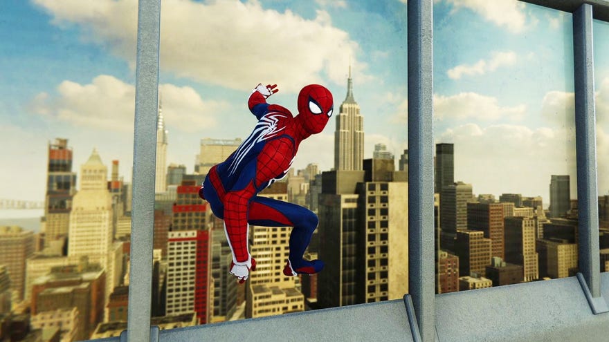 Spider-Man clings to a reflective window and looks out over New York City in Marvel’s Spider-Man Remastered