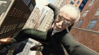 Stan Lee in a suit poses for a selfie while swinging across New York in a reskin mod for Marvel's Spider-Man Remastered.