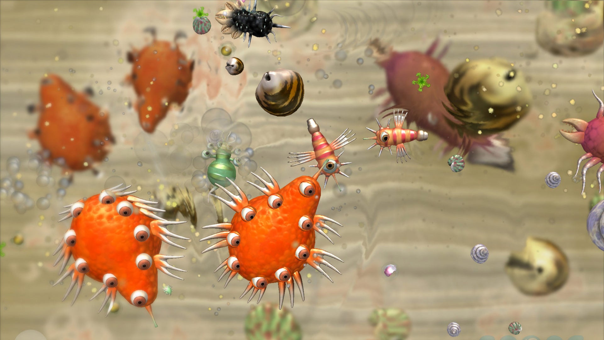 A screenshot of the Cell Stage in Spore, with several organisms of varying sizes swimming about a primordial pool. - 3