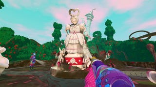 A screenshot from PowerWash Simulator's Alice's Adventures Special Pack DLC showing players hosing down a Queen of Hearts statue.