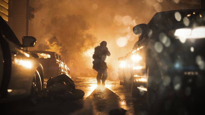 Screenshot from Call of Duty Modern Warfare showing a soldier walking through a row of vehicles as fire rages behind. A body can be seen lying on the road