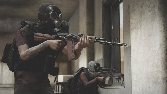 Two masked gunmen aiming from the safety of a building in Insurgency: Sandstorm