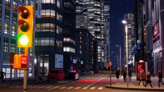 A Cities: Skylines 2 screenshot showing a city's commercial district viewed from street level at night.