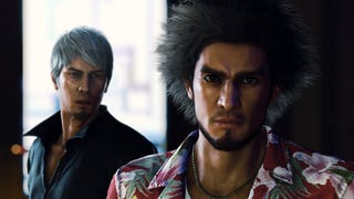 Like a Dragon: Infinite Wealth - Ichiban stands in front of Kiryu looking into the camera. Kiryu looks at Ichiban as he speaks