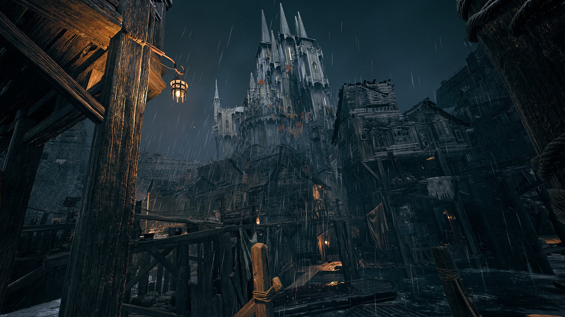 A screenshot of Remnant 2&rsquo;s The Awakened King expansion showing a vast gothic castle looming over a sprawl of dilapidated wooden shacks.