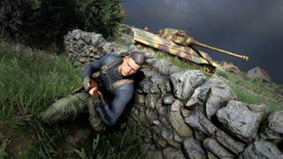 Screenshot from Sniper Elite 5 showing a tank advancing in the background as an armed solider hides behind a stone wall