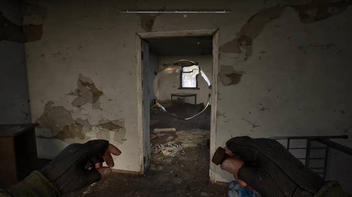 The player in Stalker 2 stands in front of an anomaly in a doorway inside a house, and prepares to throw a Bolt into the anomaly to disable it.