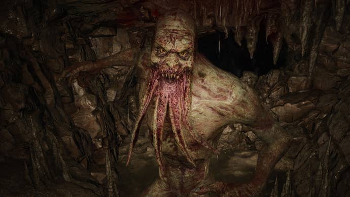 A close-up of a Bloodsucker mutant in Stalker 2 attack the player inside a cave.